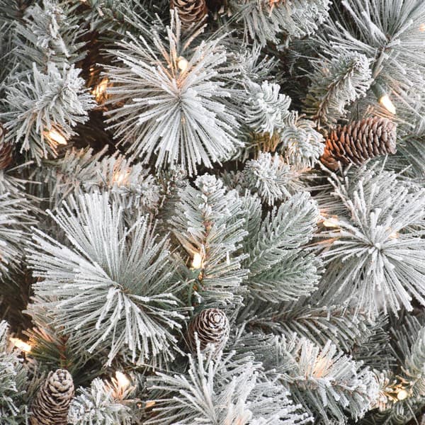 Puleo International 9ft. Pre-Lit Flocked Traditional Pine Tree