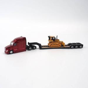 Peterbilt 579 UltraLoft Tandem Tractor with CAT D5M Dozer